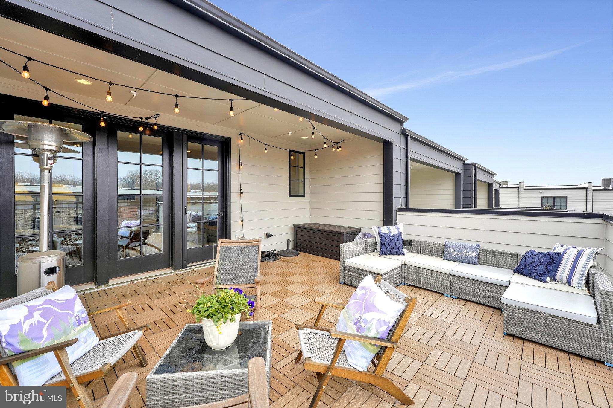 11716 Paysons Way Reston, VA 20191 - Photo 32 of 34 a outdoor living space with furniture and a potted plant