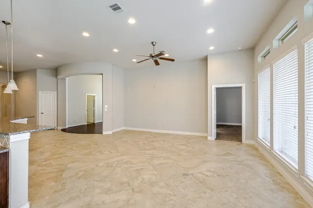 a kitchen with granite countertop a sink and a stove