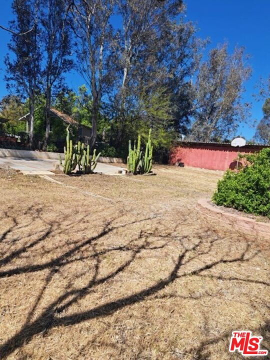 18420 Granite Avenue Riverside, CA 92508 - Photo 4 of 7 a street view with large trees