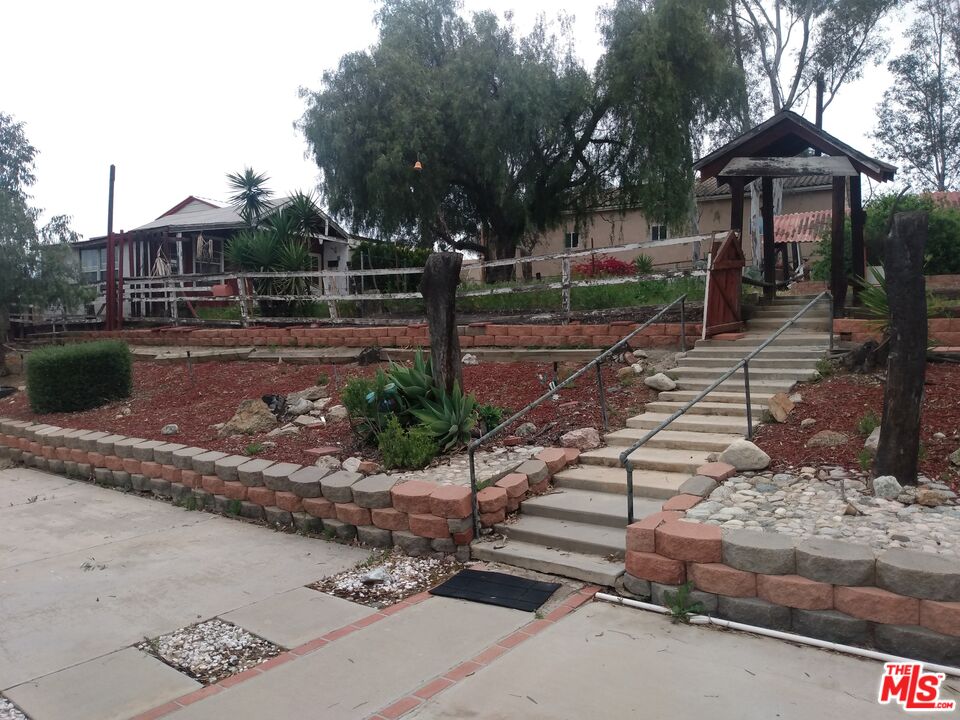 18420 Granite Avenue Riverside, CA 92508 - Photo 6 of 7 a view of a backyard with sitting area