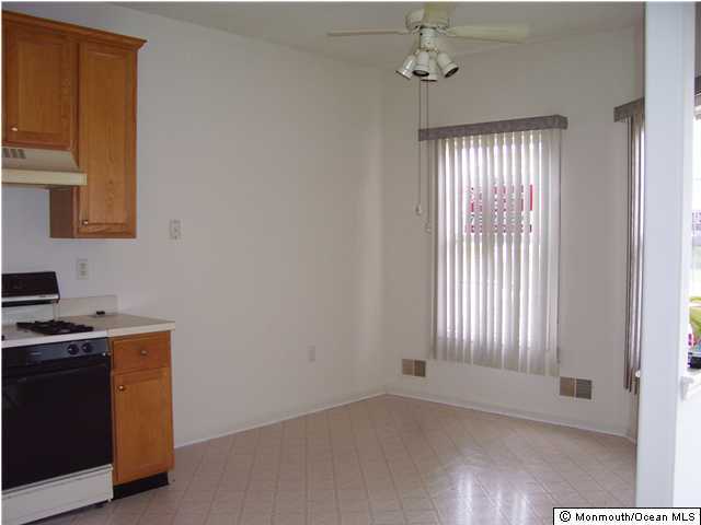 46 Riva Boulevard Brick, NJ 08723 - Photo 2 of 3 a view of an empty room with a window