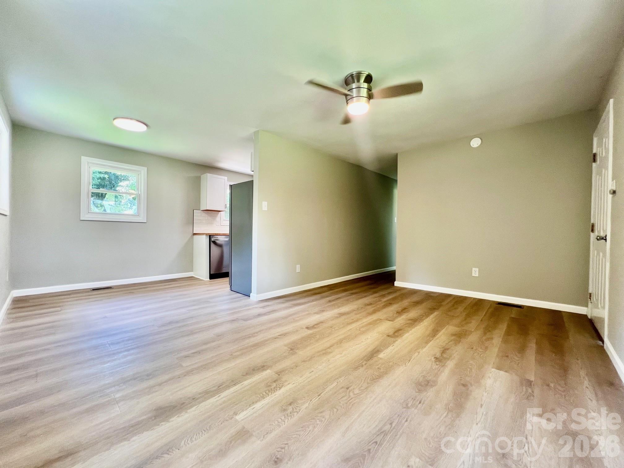 4506 Rink Dam Road Taylorsville, NC 28681 - Photo 11 of 20 wooden floor in an empty room with a window
