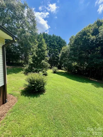 a backyard of a house with lots of green space