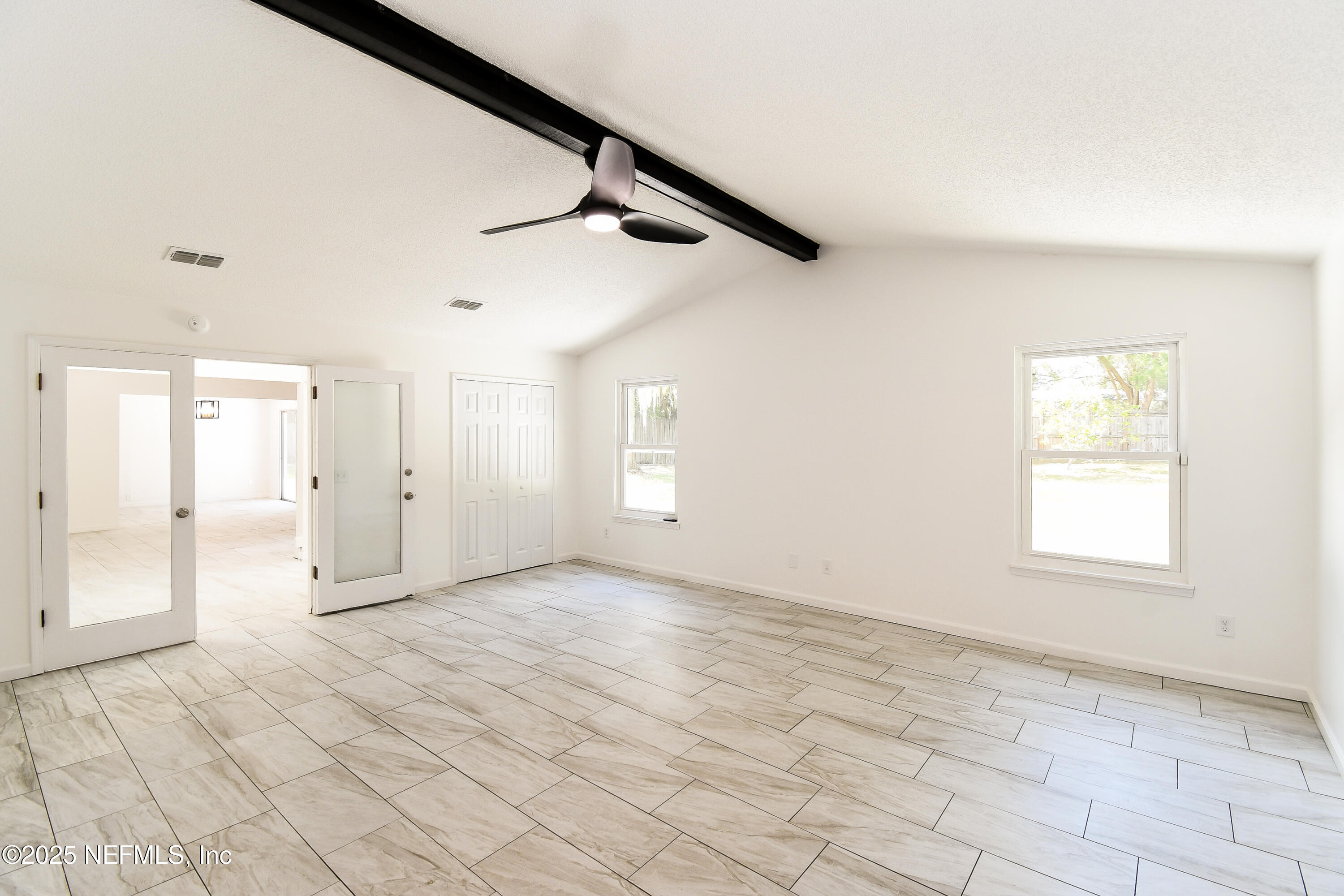 1064 Rene Court Orange Park, FL 32065 - Photo 11 of 20 an empty room with windows and closet