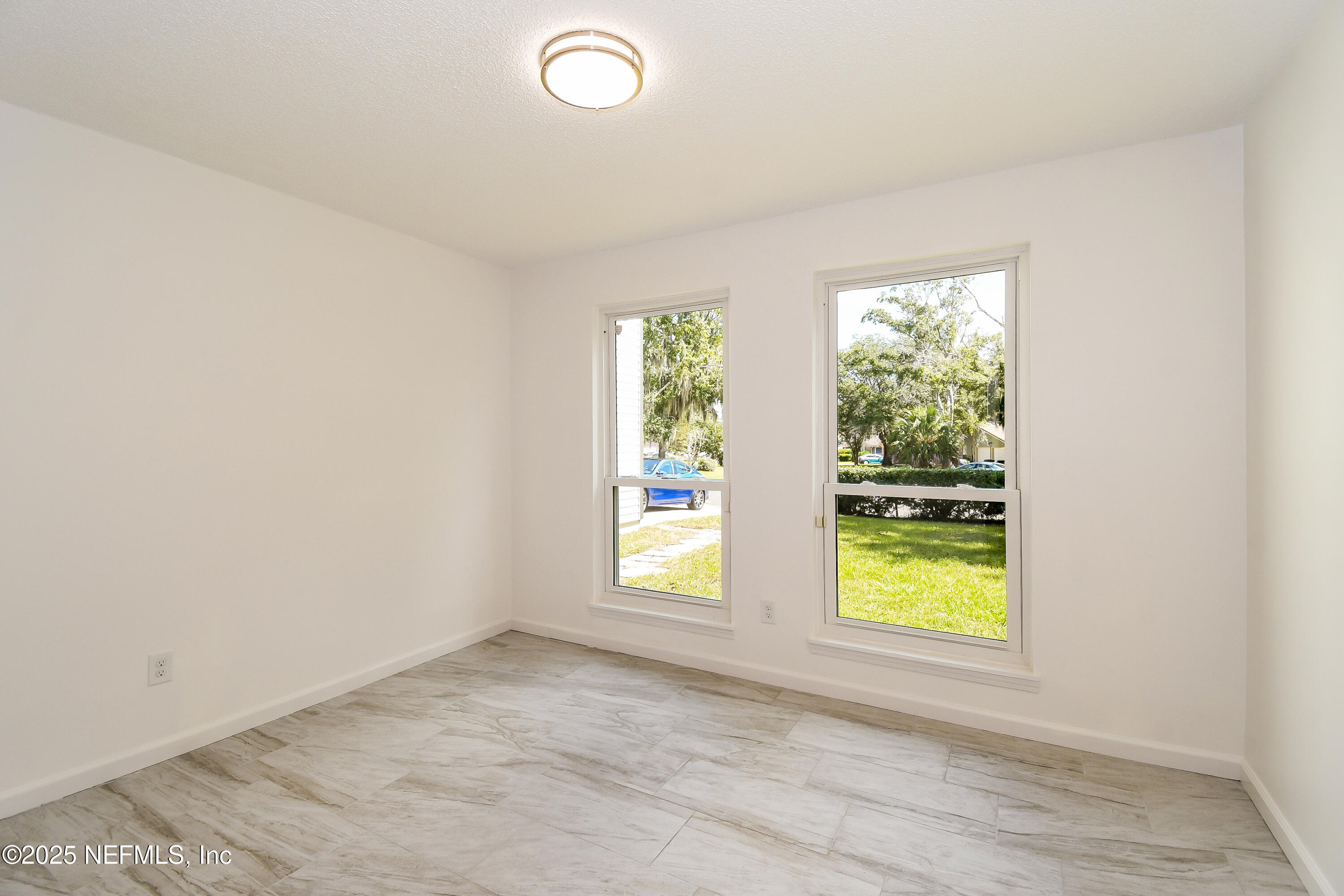 1064 Rene Court Orange Park, FL 32065 - Photo 15 of 20 an empty room with windows
