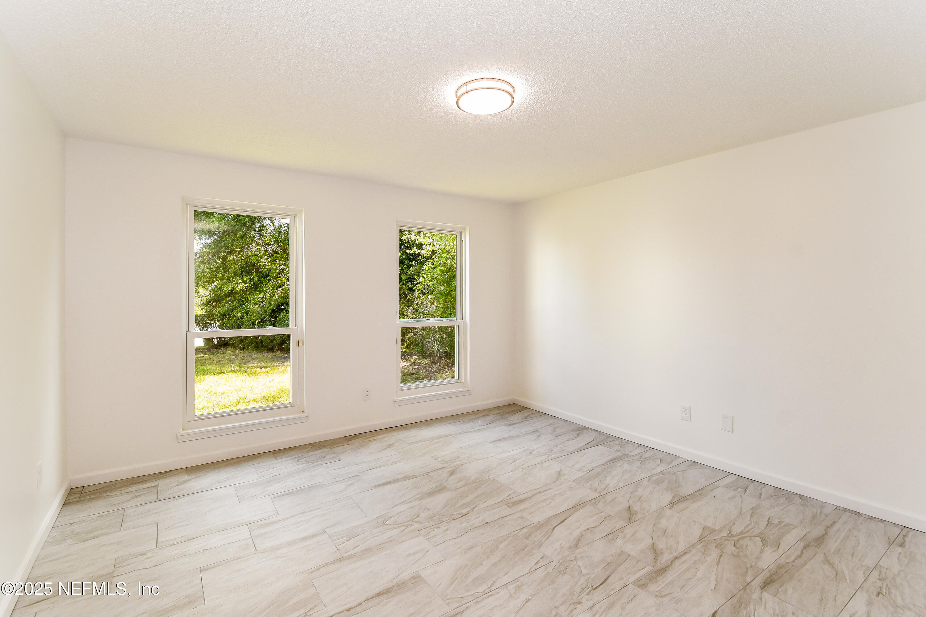 1064 Rene Court Orange Park, FL 32065 - Photo 16 of 20 an empty room with windows