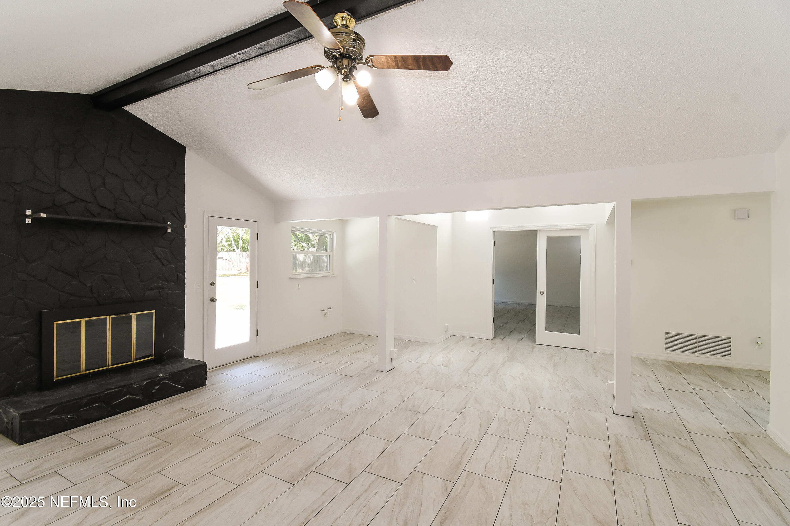 1064 Rene Court Orange Park, FL 32065 - Photo 6 of 20 an empty room with windows and ceiling fan