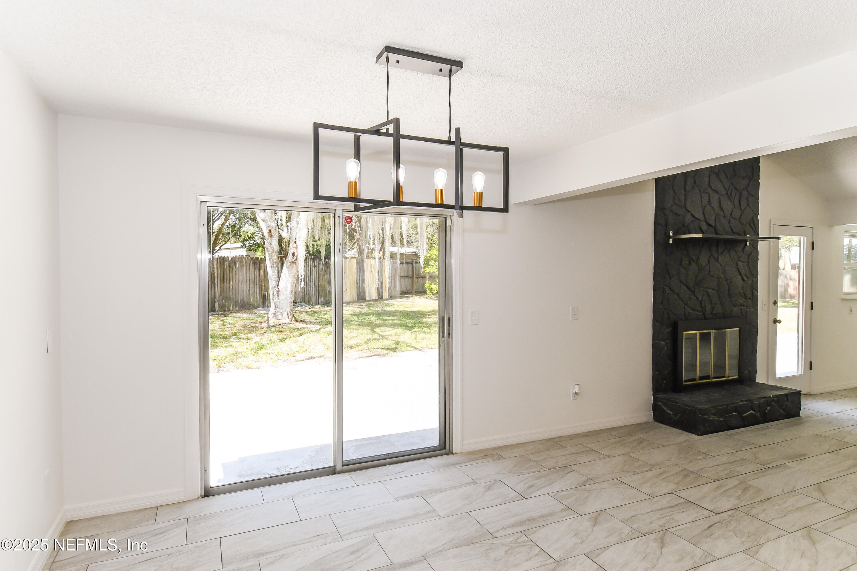 1064 Rene Court Orange Park, FL 32065 - Photo 7 of 20 a view of an empty room with a fireplace