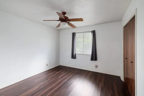 a view of an empty room and wooden floor