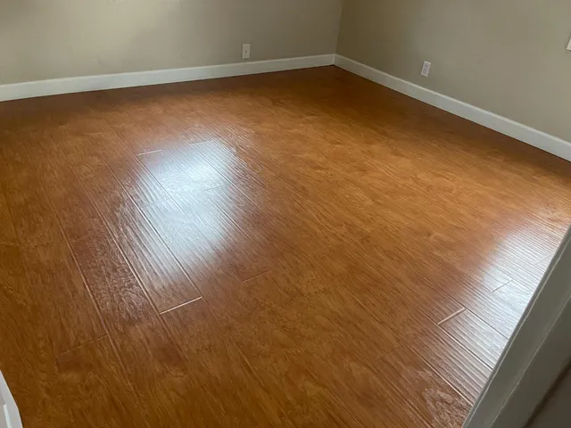 a close view of sink a stove and cabinets