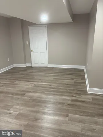 a view of room with wooden floor