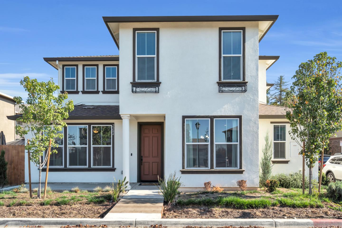a front view of a house with garden