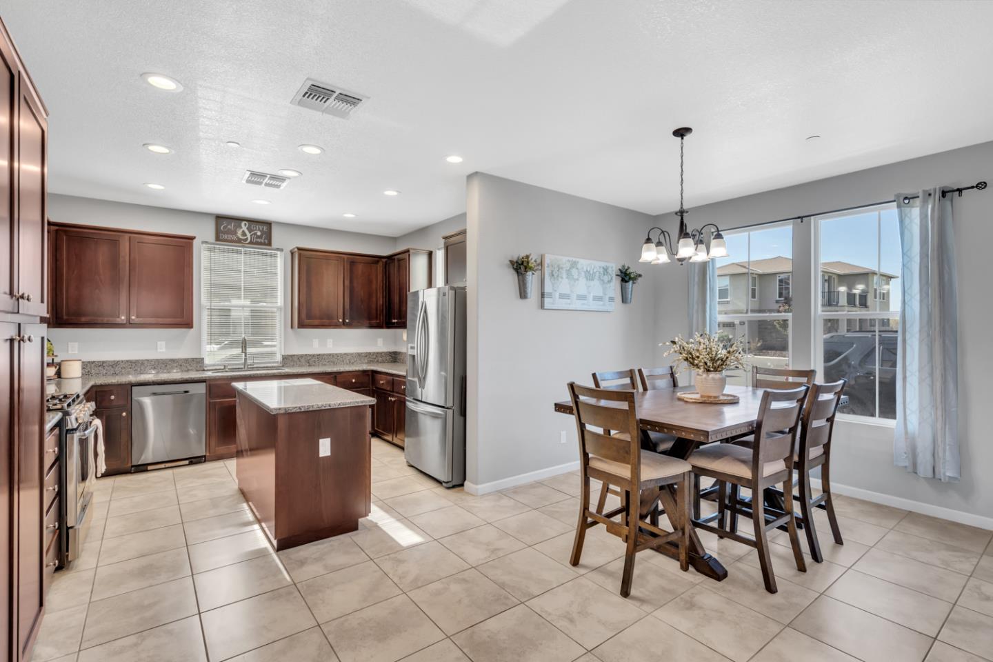 2284 Province Place Hughson, CA 95326 - Photo 12 of 53 a view of a dining room with furniture window and outside view