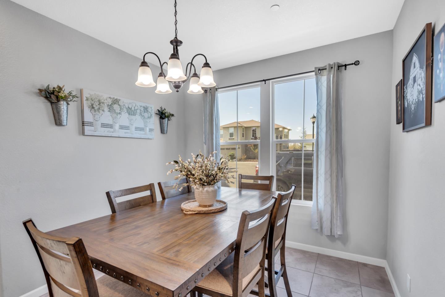 2284 Province Place Hughson, CA 95326 - Photo 13 of 53 a view of a dining room with furniture large window and chandelier