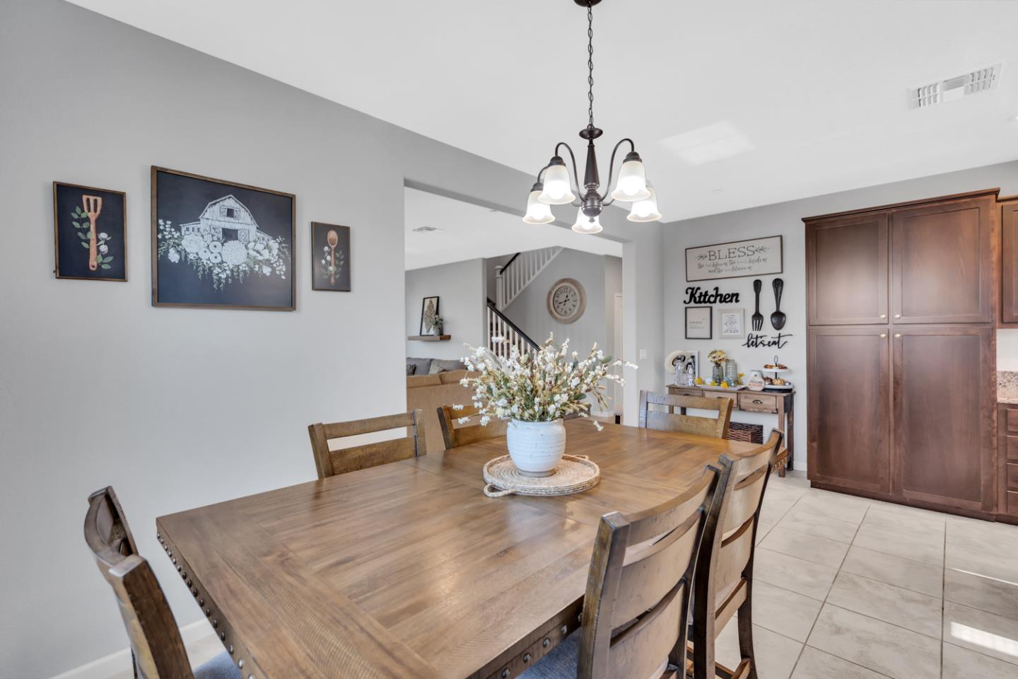 2284 Province Place Hughson, CA 95326 - Photo 15 of 53 a view of a dining room with furniture window and wooden floor