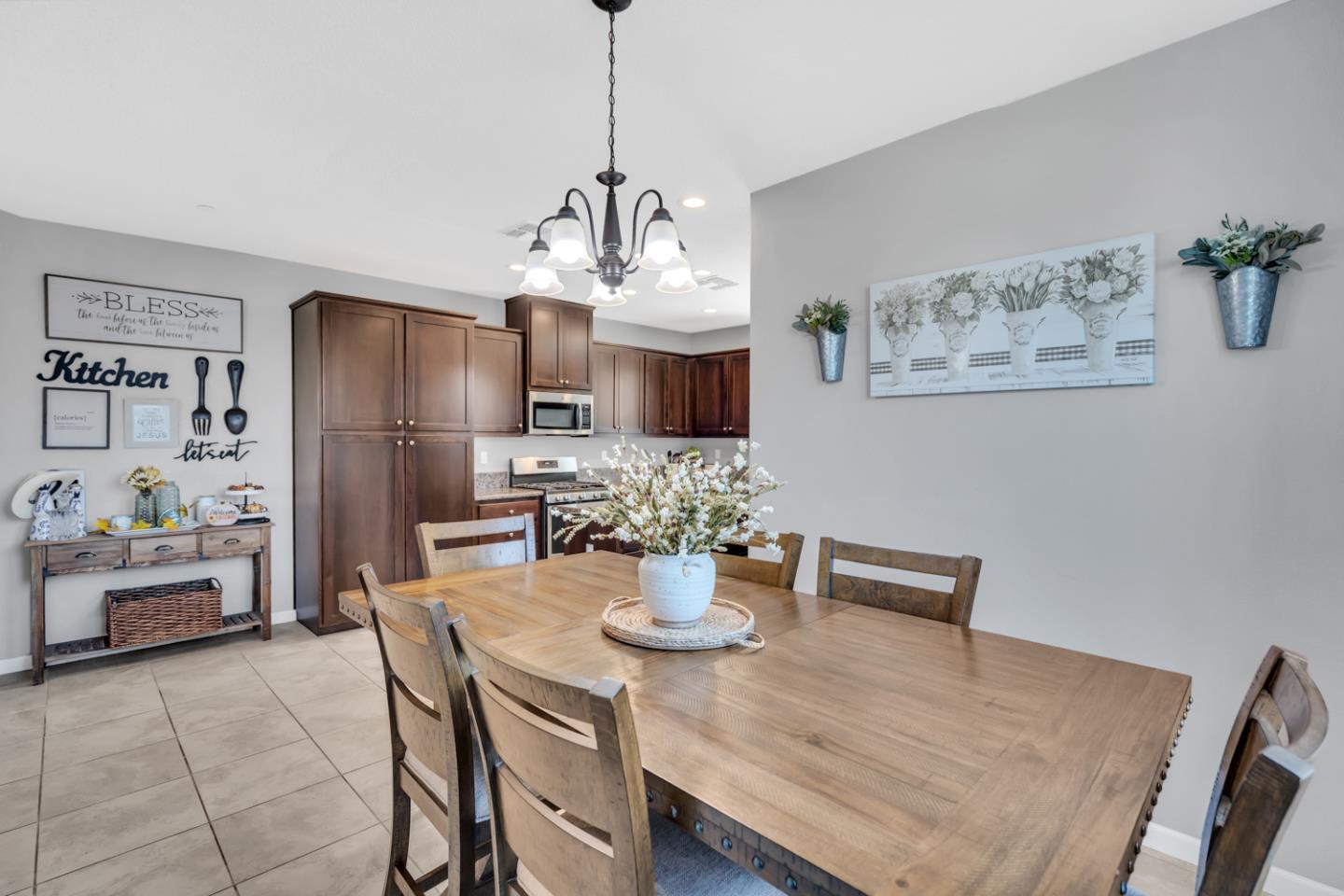 2284 Province Place Hughson, CA 95326 - Photo 16 of 53 a view of a dining room with furniture wooden floor and a chandelier