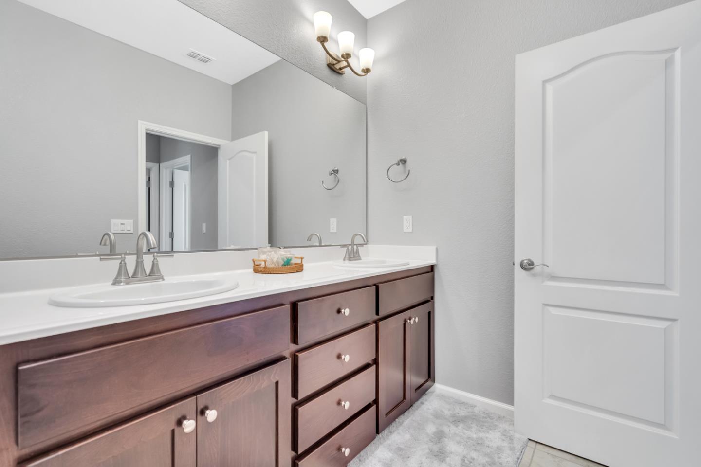 2284 Province Place Hughson, CA 95326 - Photo 32 of 53 a bathroom with a granite countertop sink and a mirror