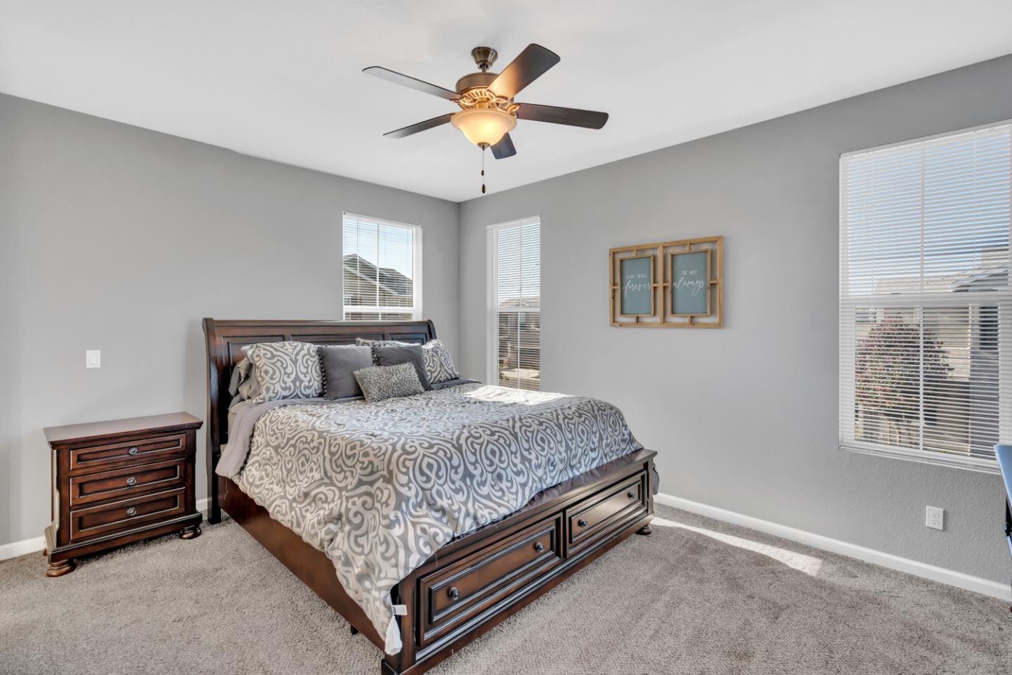 2284 Province Place Hughson, CA 95326 - Photo 42 of 53 a bed sitting in a bedroom next to a window