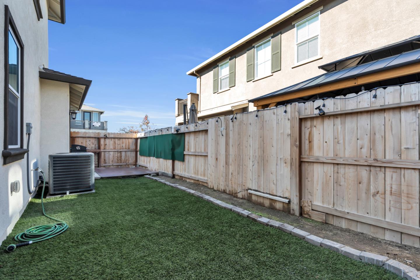 2284 Province Place Hughson, CA 95326 - Photo 49 of 53 a view of a backyard with plants and a fence
