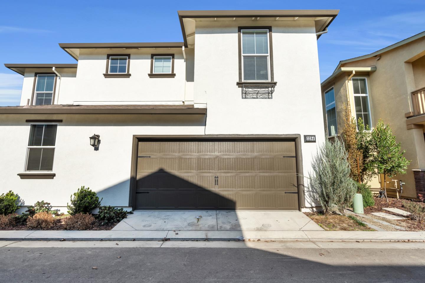 2284 Province Place Hughson, CA 95326 - Photo 6 of 53 a front view of a house with a garage