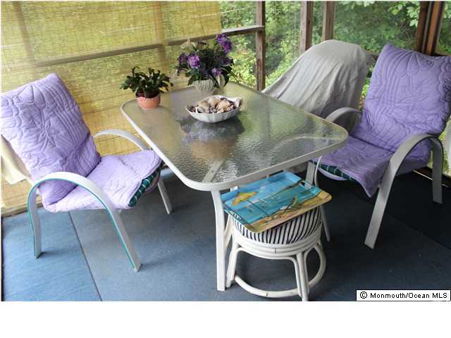 302 Church Road Brick, NJ 08723 - Photo 12 of 13 a balcony with furniture and a potted plant