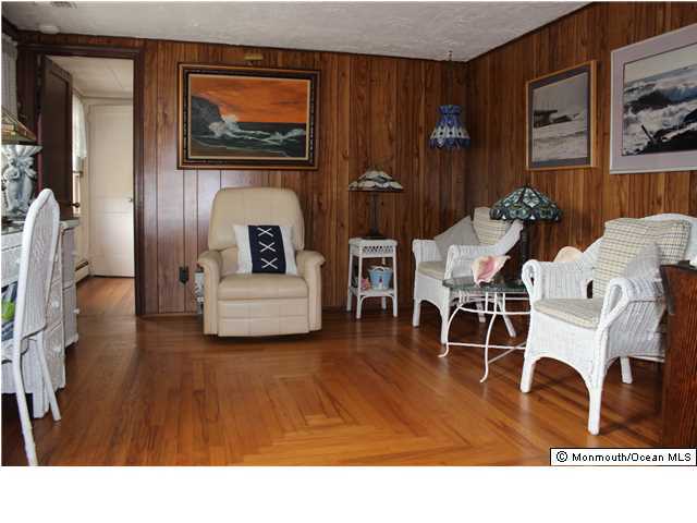 302 Church Road Brick, NJ 08723 - Photo 3 of 13 a living room with furniture and a flat screen tv