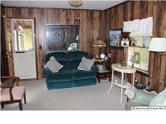 302 Church Road Brick, NJ 08723 - Photo 8 of 13 a living room with furniture a wooden floor and a sink