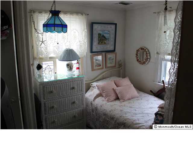 302 Church Road Brick, NJ 08723 - Photo 10 of 13 a bedroom with a bed and a window