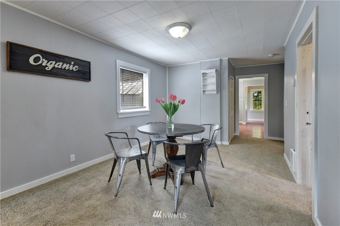 6930 Lower Ridge Road Everett, WA 98203 - Photo 3 of 15 a view of a dining room with furniture and wooden floor