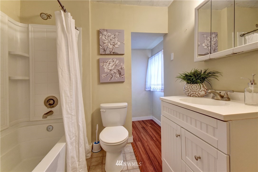 6930 Lower Ridge Road Everett, WA 98203 - Photo 5 of 15 a bathroom with a sink a toilet and shower