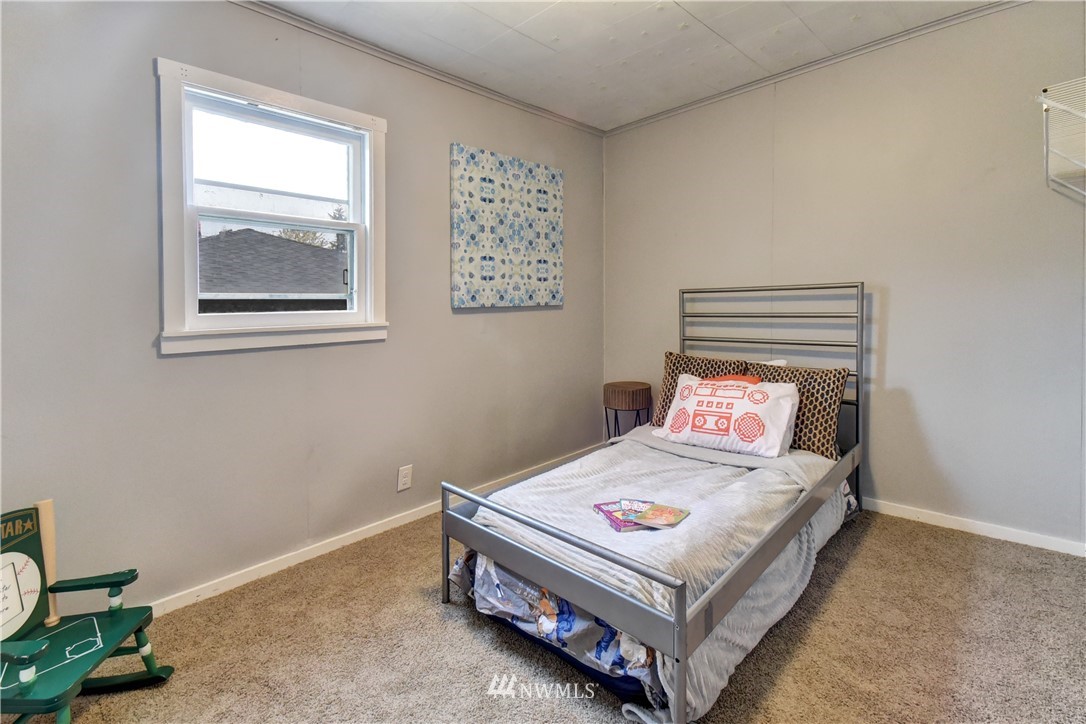 6930 Lower Ridge Road Everett, WA 98203 - Photo 6 of 15 a bedroom with a bed and window