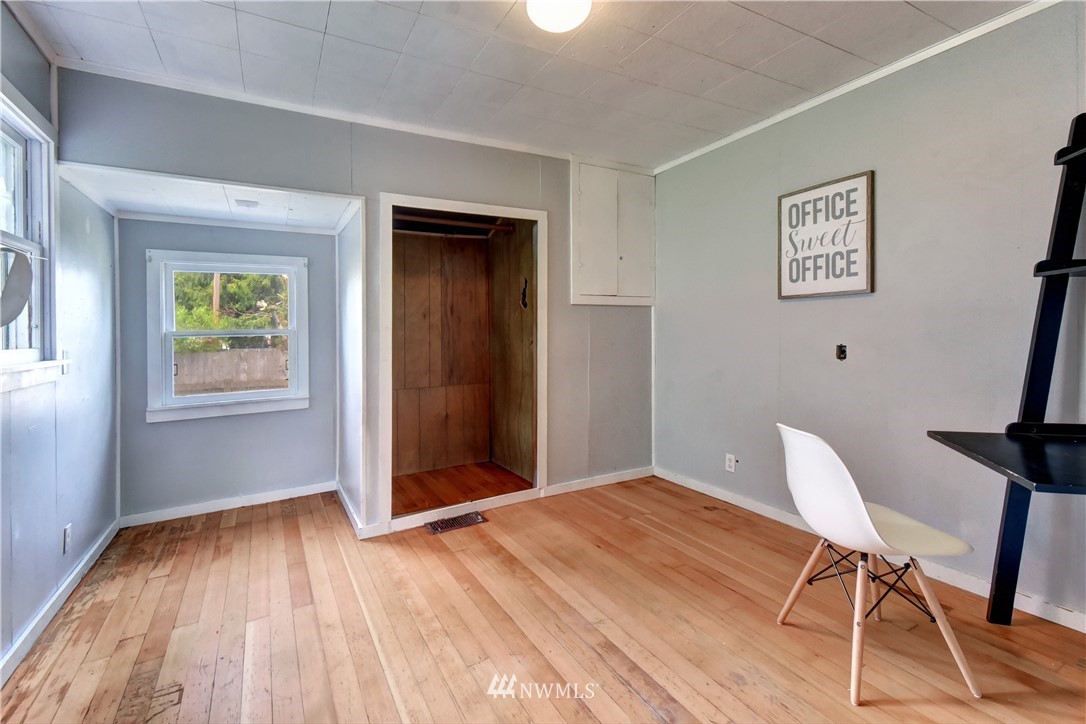 6930 Lower Ridge Road Everett, WA 98203 - Photo 8 of 15 a workspace with wooden floor and windows