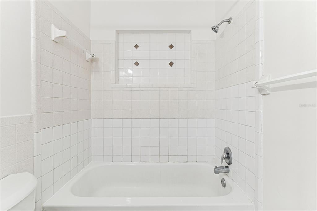 822 3rd Avenue Northwest Largo, FL 33770 - Photo 35 of 75 a close up of a bathtub curtain