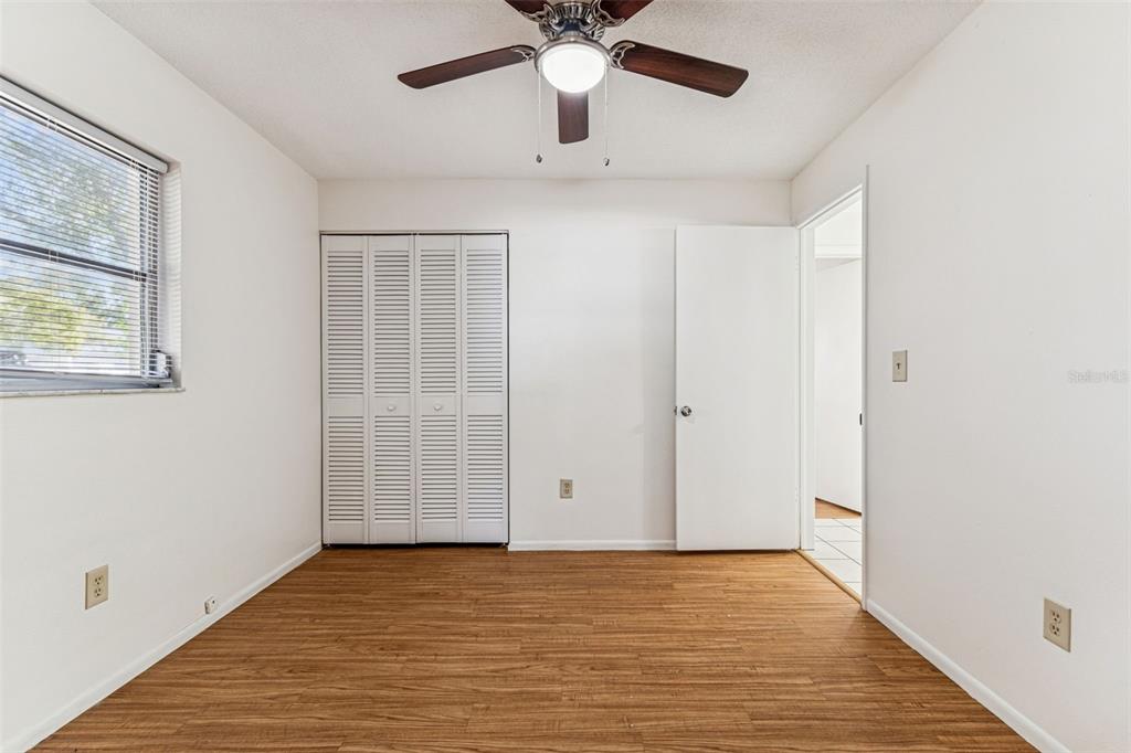 822 3rd Avenue Northwest Largo, FL 33770 - Photo 39 of 75 a view of an empty room with window and a ceiling fan