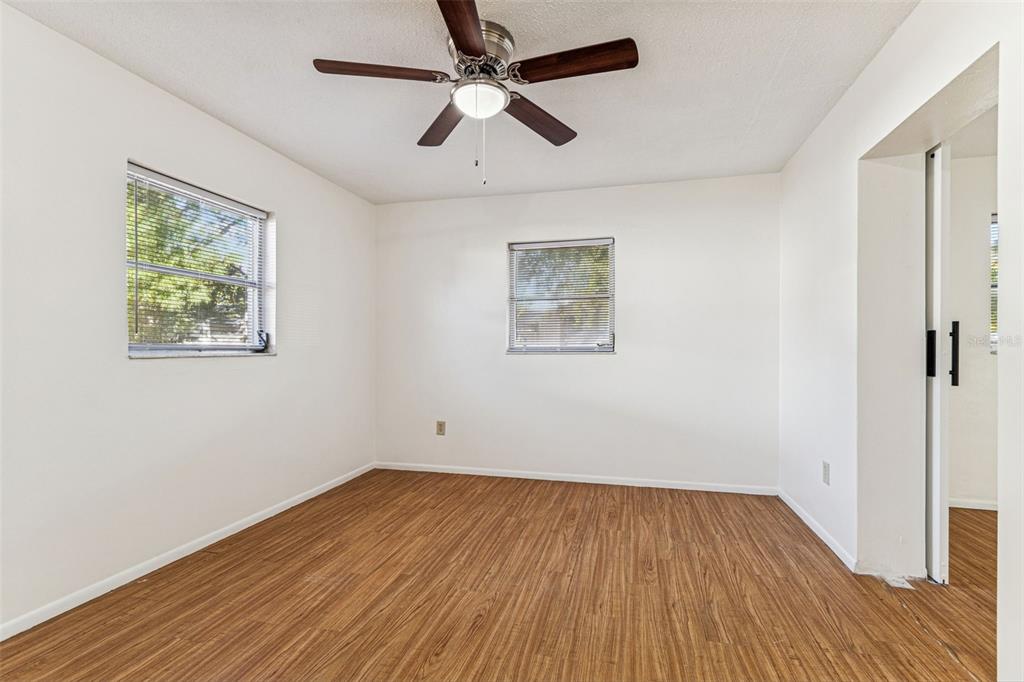 822 3rd Avenue Northwest Largo, FL 33770 - Photo 47 of 75 a view of empty room with wooden floor and fan