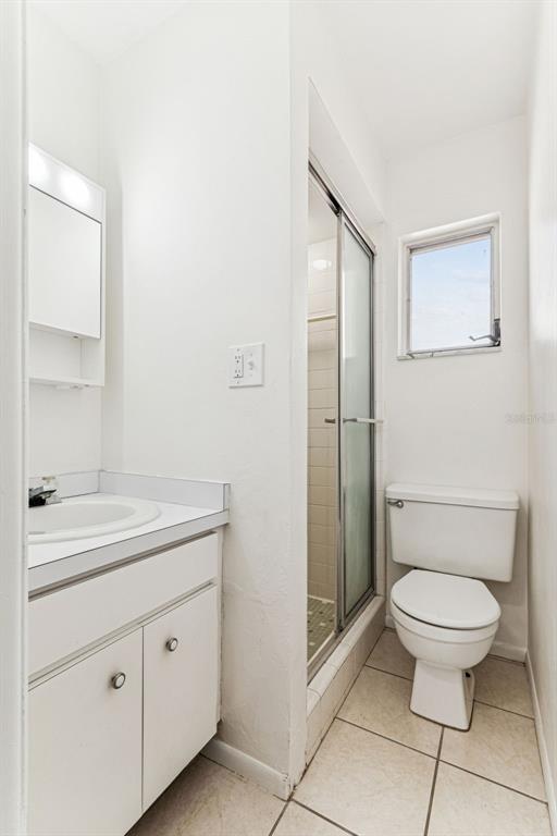 822 3rd Avenue Northwest Largo, FL 33770 - Photo 51 of 75 a bathroom with a toilet sink and shower