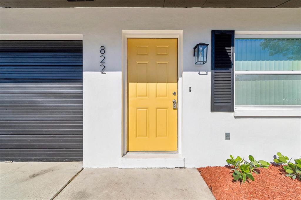 822 3rd Avenue Northwest Largo, FL 33770 - Photo 6 of 75 a front view of a house with a garage