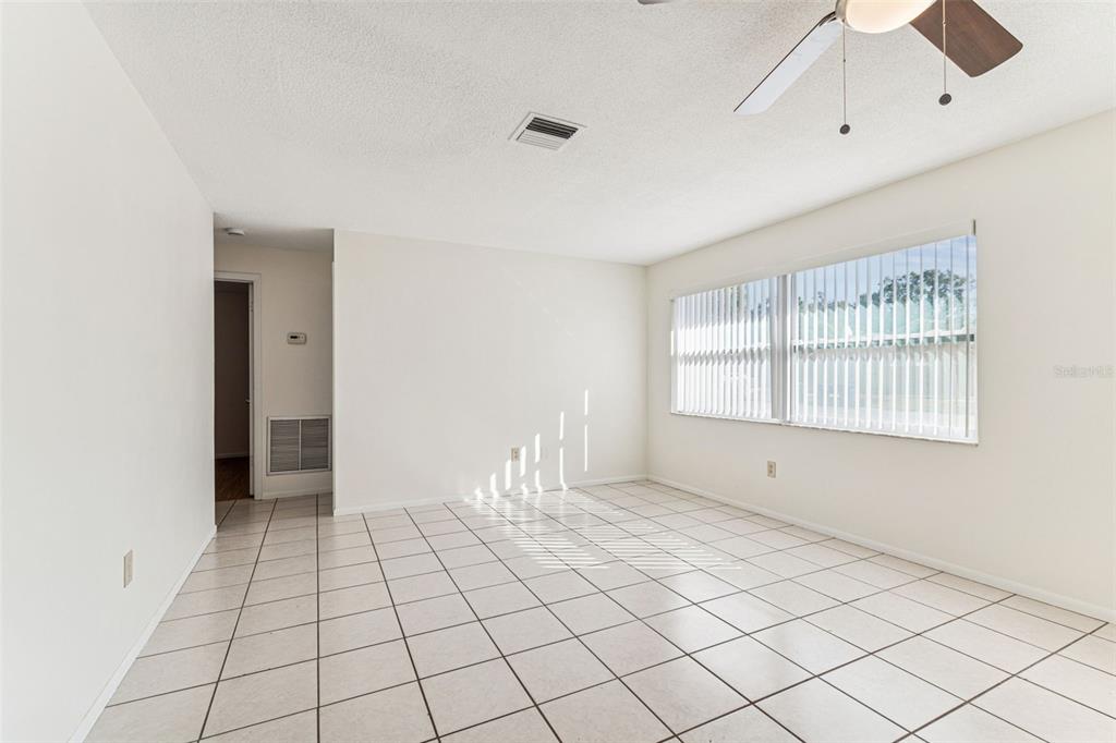 822 3rd Avenue Northwest Largo, FL 33770 - Photo 9 of 75 a view of an empty room with a window
