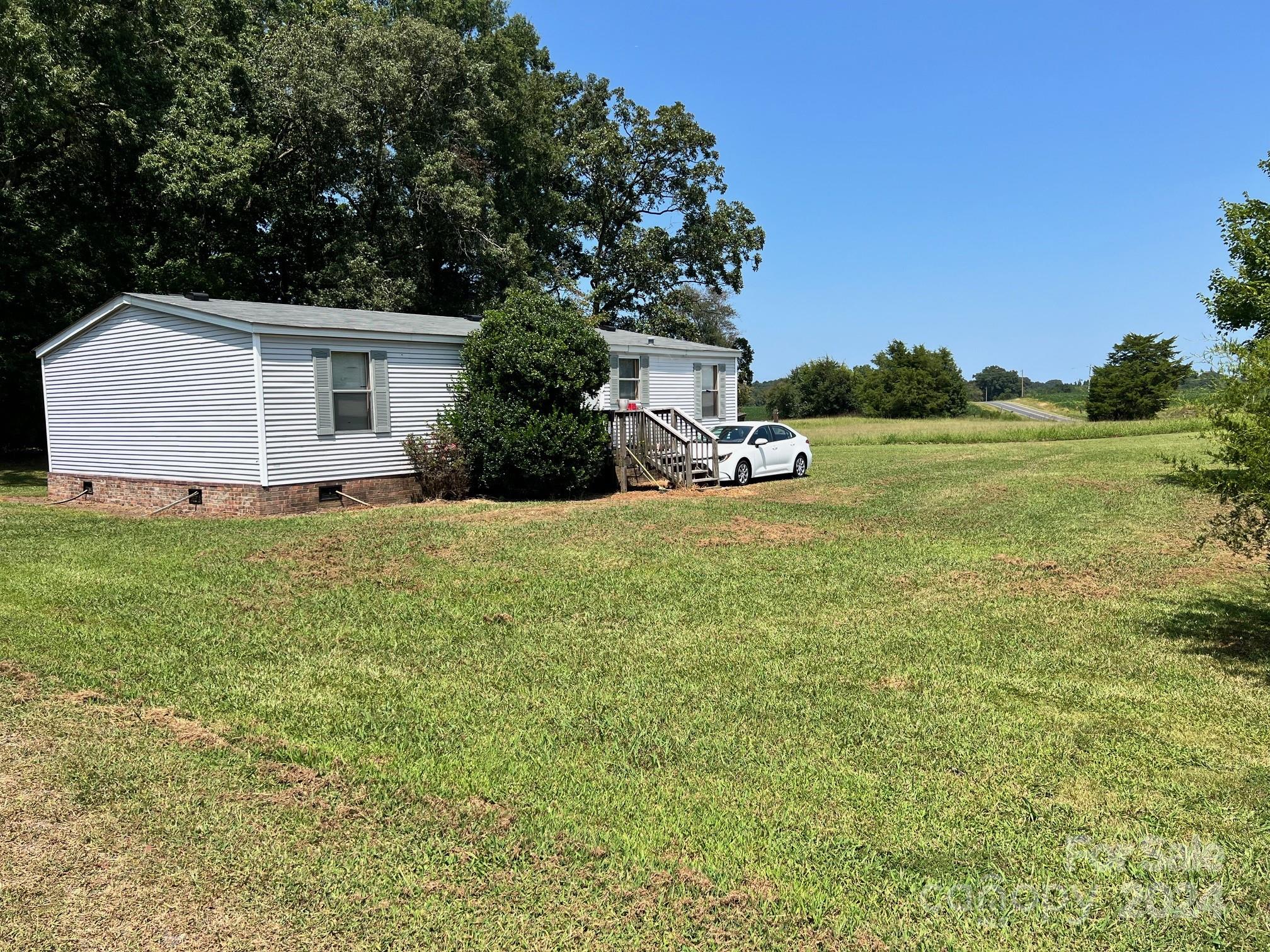 414 Drye Road Polkton, NC 28135 - Photo 4 of 12 a view of a house with yard and sitting area