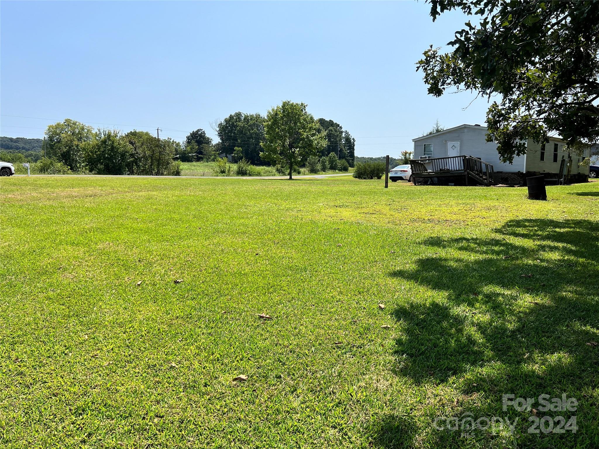 414 Drye Road Polkton, NC 28135 - Photo 5 of 12 a view of yard with swimming pool and green space