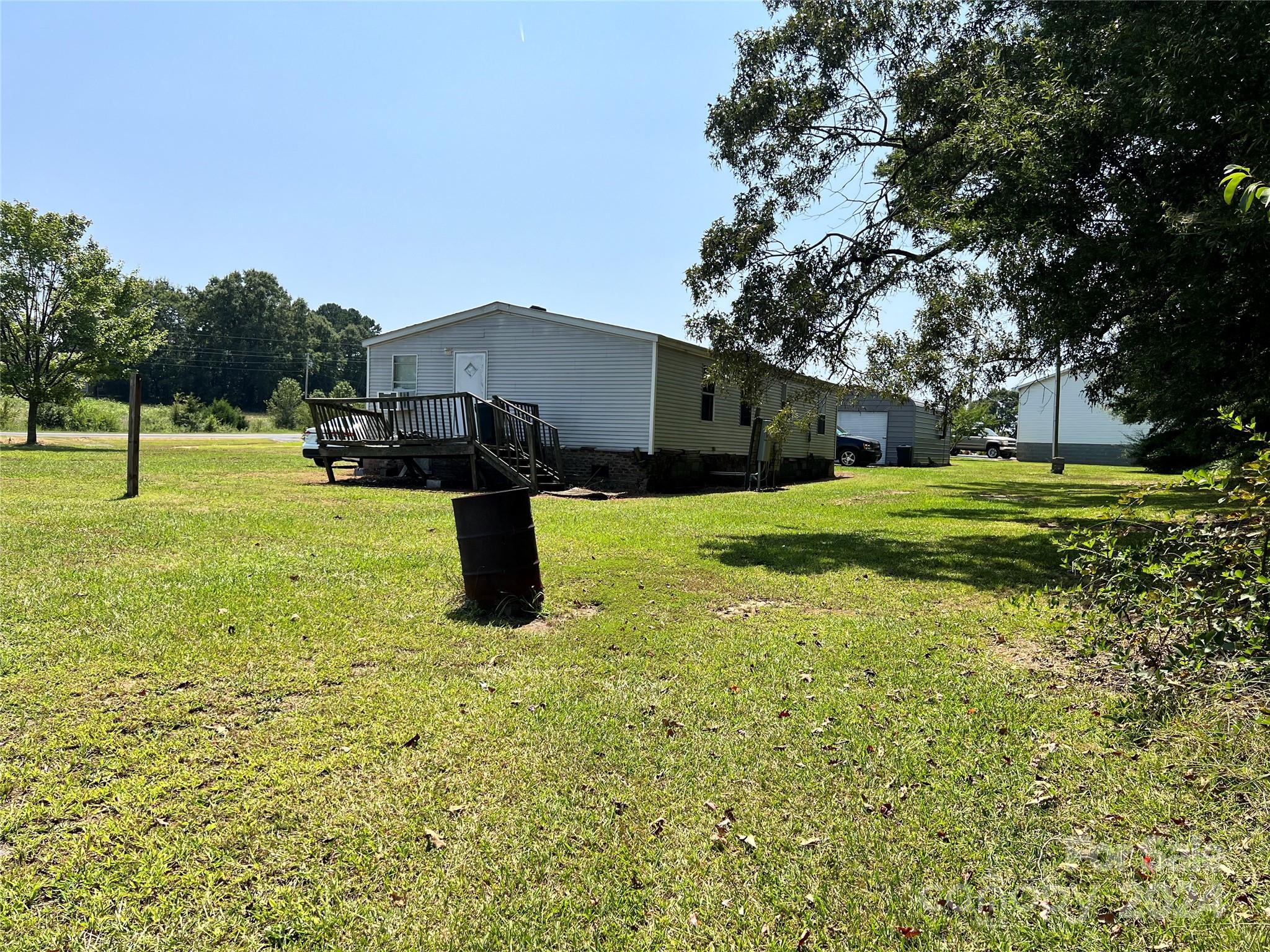 414 Drye Road Polkton, NC 28135 - Photo 6 of 12 a backyard of a house with table and chairs
