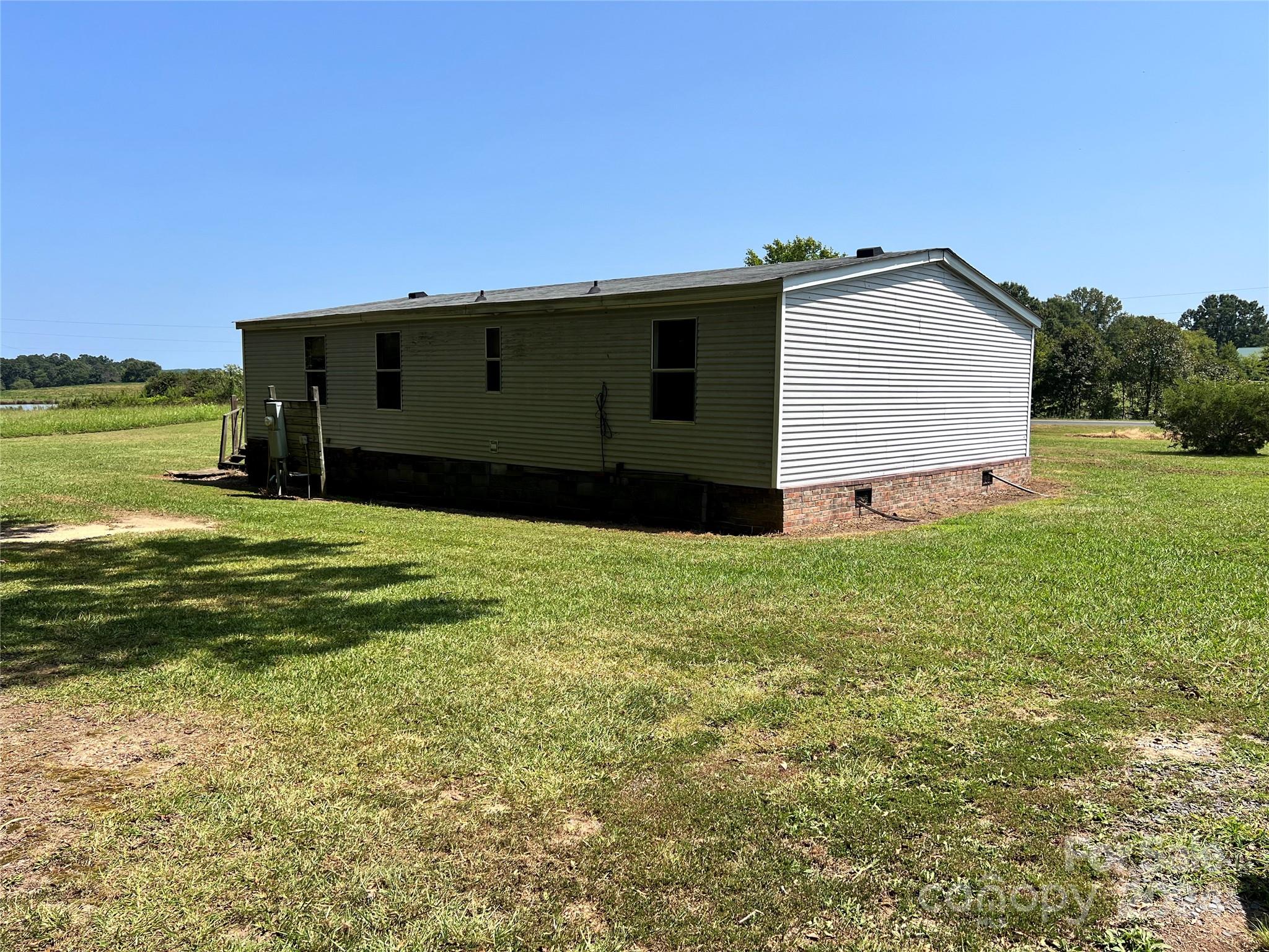 414 Drye Road Polkton, NC 28135 - Photo 9 of 12 a view of a house with a yard