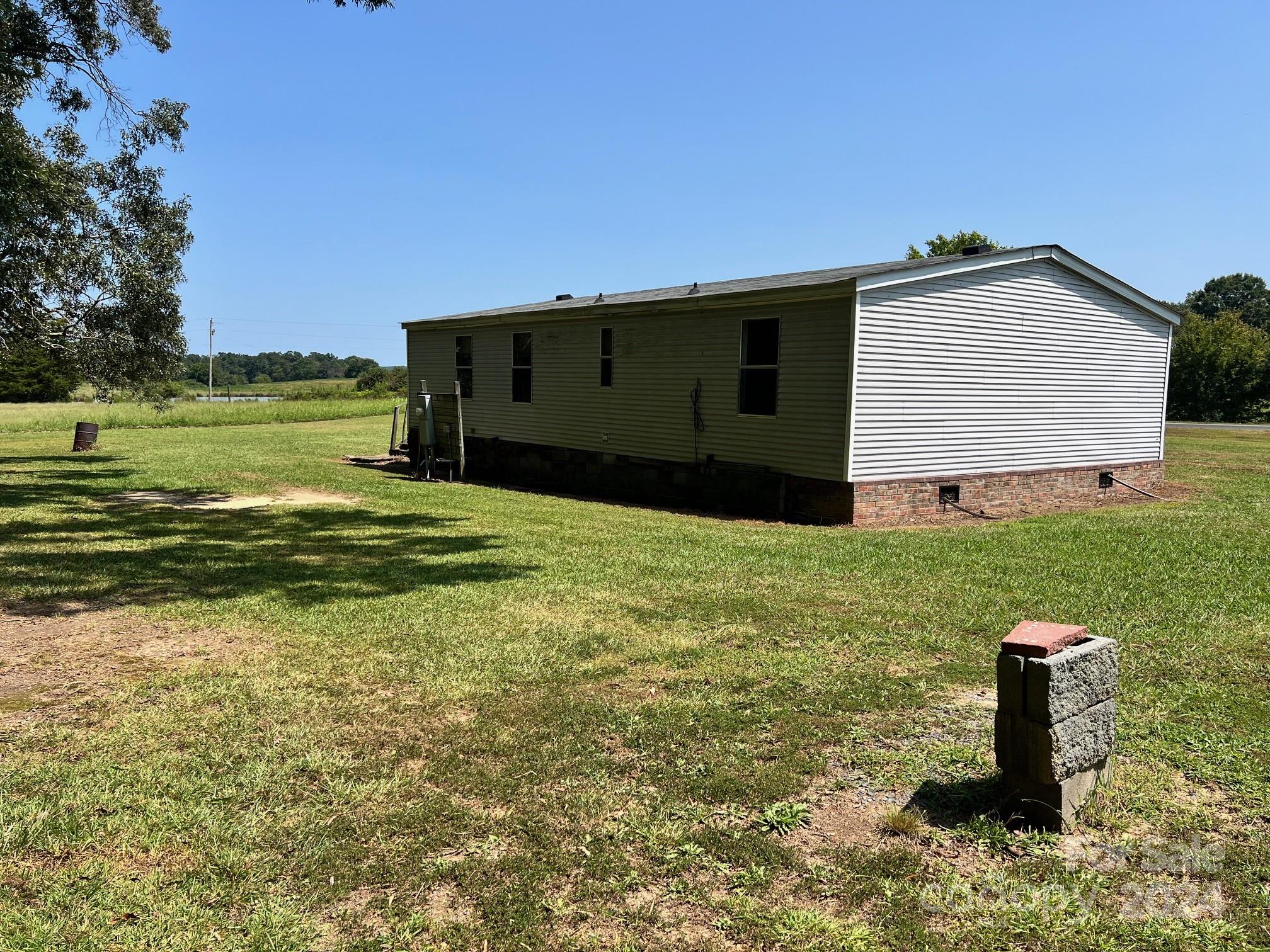 414 Drye Road Polkton, NC 28135 - Photo 10 of 12 a view of a house with a yard