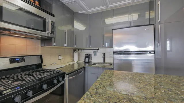 a bedroom with two beds and a flat screen tv