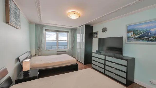 a bedroom with double bed and a window