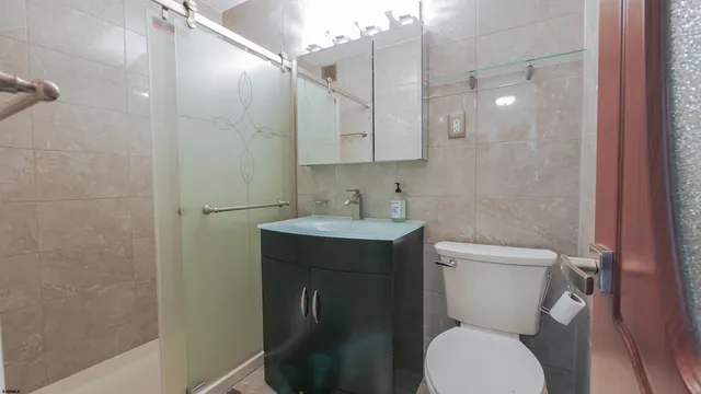 a lobby with furniture and potted plants