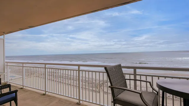 a balcony with view of seating area