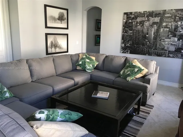 a view of a livingroom with furniture and windows