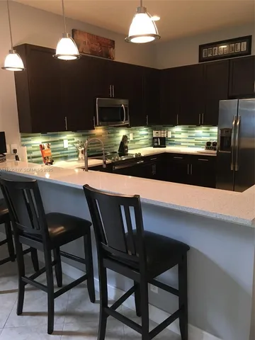 a living room with furniture and a couch