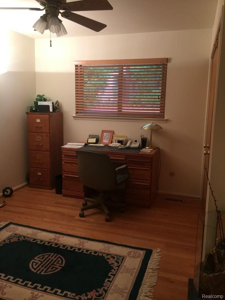 21160 Andover Road Southfield, MI 48076 - Photo 20 of 28 Bedroom 3 used as office with double closets & HW floors, ceiling fan